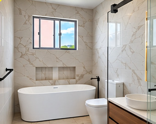 RAVZ bathroom with freestanding bath and marble-look tiles